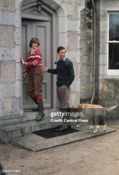 British Royals Lady Diana Spencer , wearing a horizontally-striped sweater with her trousers tucked into her wellington boots, with her fiance,...