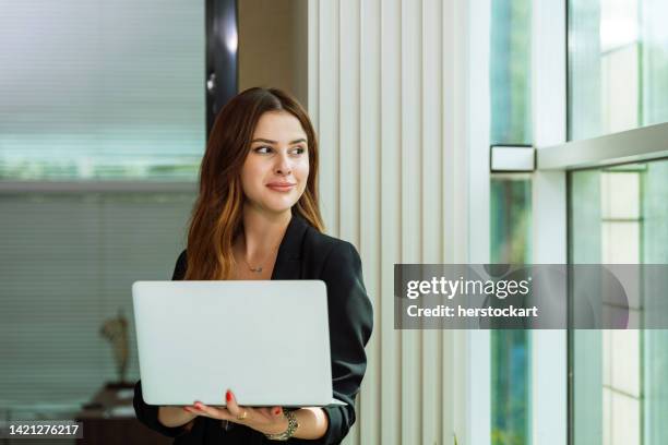 professional businesswoman working with her laptop - journalist laptop stock pictures, royalty-free photos & images