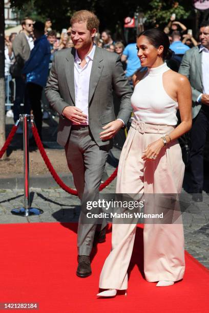 Prince Harry, Duke of Sussex and Meghan, Duchess of Sussex arrive on the red carpet to be welcomed by the Mayor during the Invictus Games Dusseldorf...