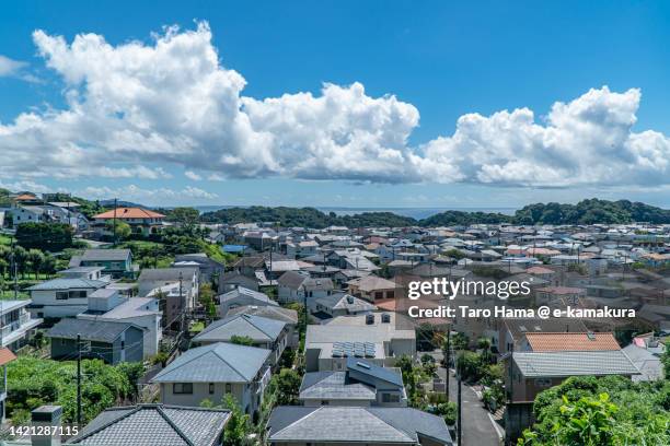 summer clouds over the residential district by the sea in kanagawa of japan - kanagawa prefecture stock pictures, royalty-free photos & images