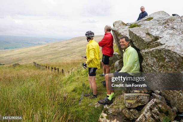 Fans wait as the peloton approaches the climb at Chapel Fell in Weardale during Stage 3 of the Tour of Britain on September 06, 2022 in Barnard...
