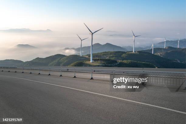 wind power station next to the road on the top of the mountain - car top view stock pictures, royalty-free photos & images