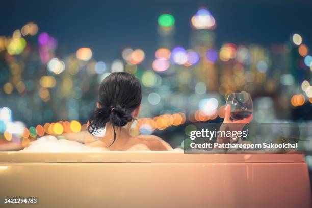 allure of the city - women of penthouse stock pictures, royalty-free photos & images
