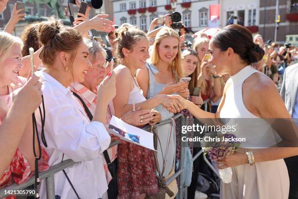 Meghan, Duchess of Sussex is greeted by well-wishers outside the town hall during the Invictus Games Dusseldorf 2023 - One Year To Go events, on...