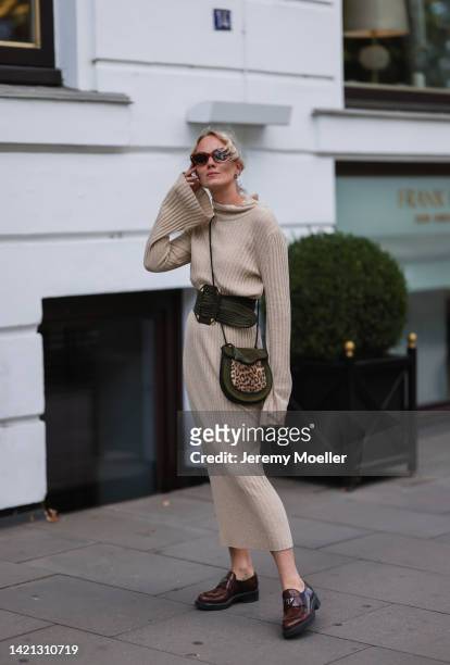 Kate Gelinsky is seen wearing a beige SoSue dress, ysl black belt and black and beige bag, prada brown leather loafer, chimi eyewear shades on...