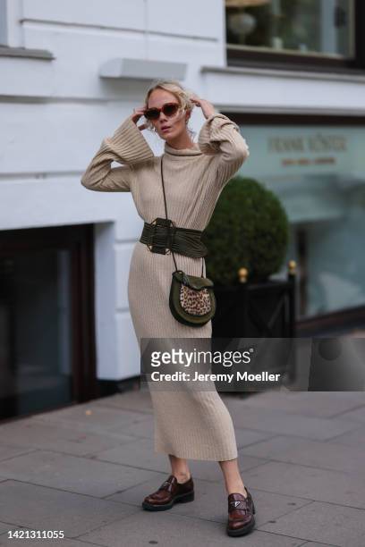 Kate Gelinsky is seen wearing a beige SoSue dress, ysl black belt and black and beige bag, prada brown leather loafer, chimi eyewear shades on...