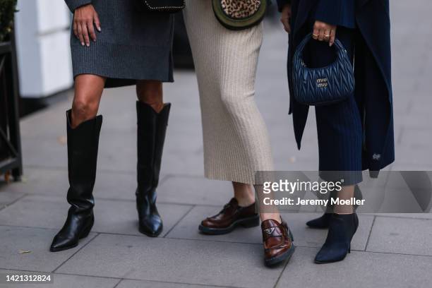 Katrin Lehbruner is seen wearing Isabel Marant black boots, ysl black bag, SoSue grey dress, Celine black shades and Kate Gelinsky is seen wearing a...
