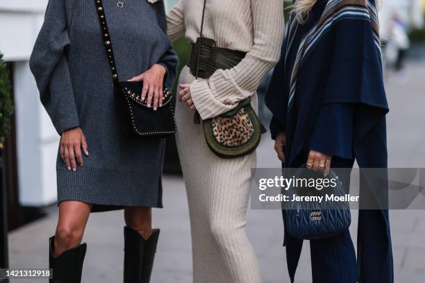 Katrin Lehbruner is seen wearing Isabel Marant black boots, ysl black bag, SoSue grey dress, Celine black shades and Kate Gelinsky is seen wearing a...