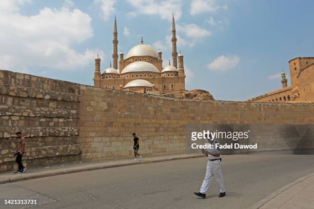 People walk outside Muhammad Ali Mosque on September 6, 2022 in Cairo, Egypt. Also known as the Citadel of Saladin, this stone, medieval, Islamic-era...