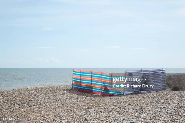 a windbreak on a beach - aldeburgh stock pictures, royalty-free photos & images