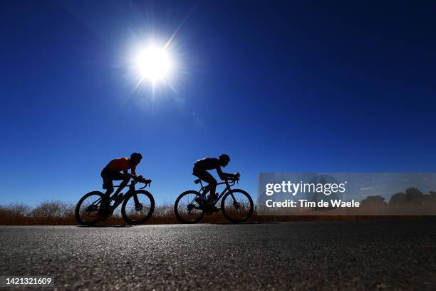 Silhouette of Ander Okamika Bengoetxea of Spain and Team Burgos - BH and Luis Ángel Maté Mardones of Spain and Team Euskaltel - Euskadi competing in...