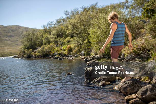 Man Balancing Rocks 32 Balancing Rocks Lake Stock Photos, High-Res Pictures, and Images ...