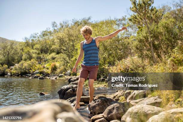 Man Balancing Rocks 32 Balancing Rocks Lake Stock Photos, High-Res Pictures, and Images ...