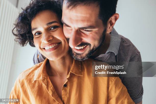 a close up view of a beautiful happy couple hugging - tooth bonding stock pictures, royalty-free photos & images