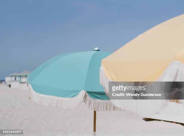 miami beach umbrellas - frayed stock pictures, royalty-free photos & images