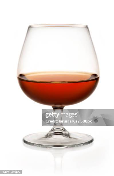 close-up of wineglass against white background - bicchiere da brandy foto e immagini stock