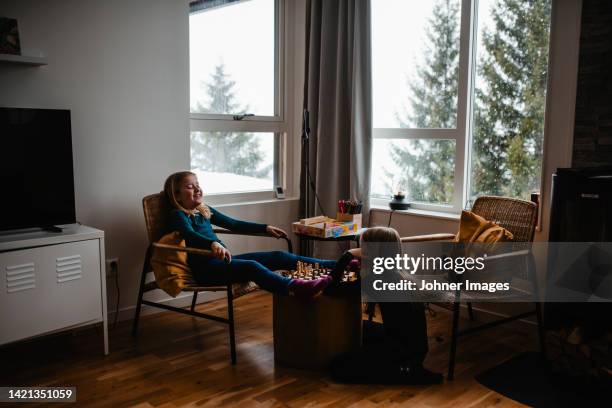 girls playing chess - game night stock pictures, royalty-free photos & images