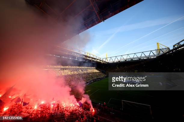 Fans show their support with flares prior to the UEFA Champions League group G match between Borussia Dortmund and FC Copenhagen at Signal Iduna Park...