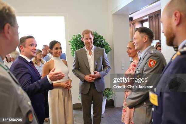 Meghan, Duchess of Sussex and Prince Harry, Duke of Sussex meet members of the military at the town hall during the Invictus Games Dusseldorf 2023 -...