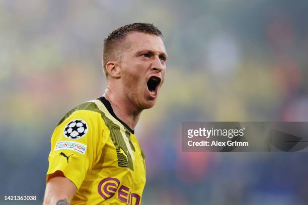 Marco Reus of Borussia Dortmund celebrates after scoring their team's first goal during the UEFA Champions League group G match between Borussia...