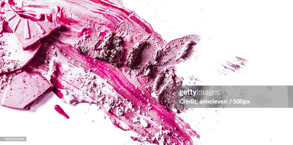 Crushed eyeshadow,Powder and liquid foundation close-up isolated on