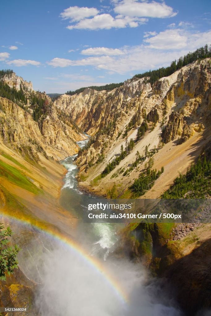 Scenic view of waterfall against sky