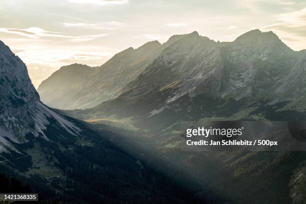 scenic view of mountains against sky during sunset,austria - karwendel stock-fotos und bilder