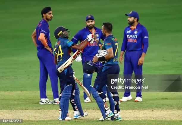 Dasun Shanaka of Sri Lanka and Bhanuka Rajapakse of Sri Lanka celebrates victory after the DP World Asia Cup match between India and Sri Lanka on...