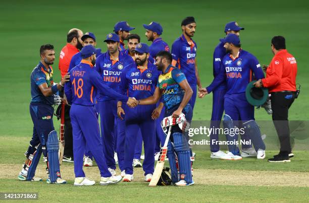 Players of India and Sri Lanka shake hands after the DP World Asia Cup match between India and Sri Lanka on September 06, 2022 in Dubai, United Arab...