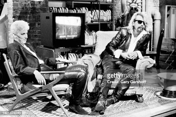 View of Scottish musician Annie Lennox and English musician Dave Stewart, both of the group Eurythmics, as they sit in chairs during an interview on...