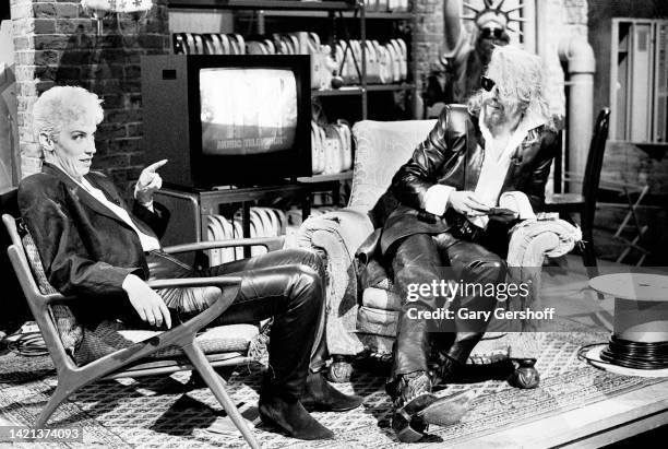 View of Scottish musician Annie Lennox and English musician Dave Stewart, both of the group Eurythmics, as they sit in chairs during an interview on...