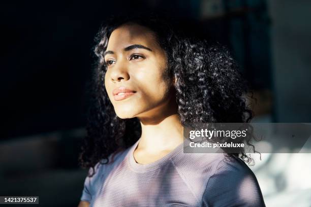 beauty, hope and a woman thinking at a room window, looking outside, with sunshine in her face. happy morning, a smile and dreaming of summer romance, girl lost in romantic thoughts in her bedroom - portrait shadow stock pictures, royalty-free photos & images