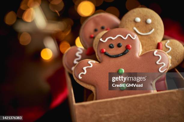 gingerbread christmas cookies in christmas home atmosphere - gingerbread men stock pictures, royalty-free photos & images