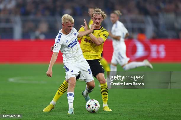 Hakon Arnar Haraldsson of FC Copenhagen battles for possession with Julian Brandt of Borussia Dortmund during the UEFA Champions League group G match...