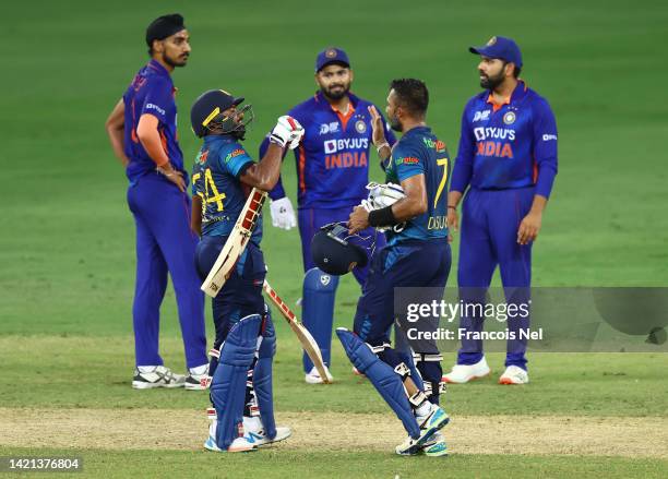 Dasun Shanaka of Sri Lanka and Bhanuka Rajapakse of Sri Lanka celebrates victory after the DP World Asia Cup match between India and Sri Lanka on...