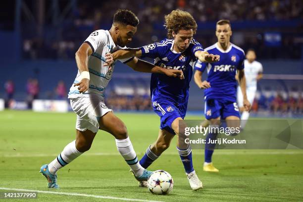 Reece James of Chelsea is challenged by Robert Ljubicic of Dinamo Zagreb during the UEFA Champions League group E match between Dinamo Zagreb and...