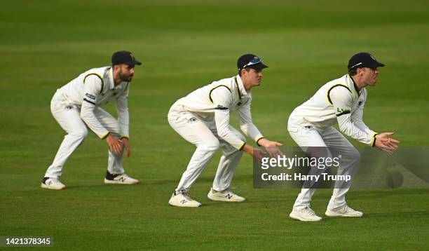 Jack Taylor, Ollie Price and Marcus Harris of Gloucestershire look on during Day Two of the LV= Insurance County Championship match between Somerset...