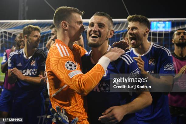 Dominik Livakovic of Dinamo Zagreb celebrates with teammates after their sides victory during the UEFA Champions League group E match between Dinamo...