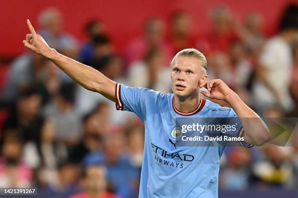 Erling Haaland of Manchester City celebrates after scoring their side's first goal during the UEFA Champions League group G match between Sevilla FC...