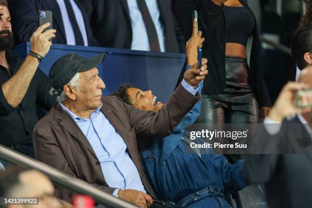 Gerard Darmon and Tina Kunakey attend the UEFA Champions League group H match between Paris Saint-Germain and Juventus at Parc des Princes on...