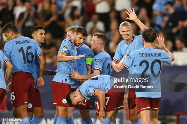 Erling Haaland of Manchester City celebrates with teammates after scoring their team's third goal during the UEFA Champions League group G match...