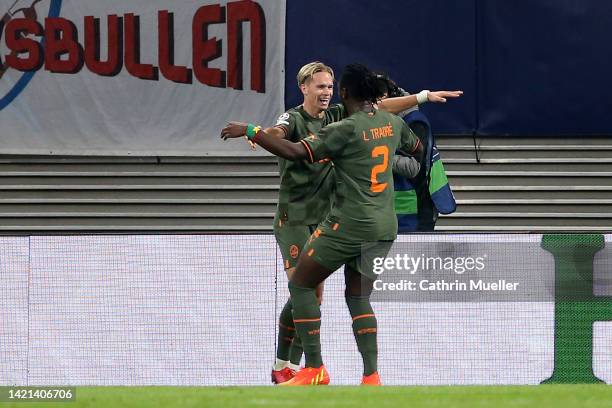 Lassina Traore of Shakhtar Donetsk celebrates with teammates after scoring their team's fourth goal during the UEFA Champions League group F match...