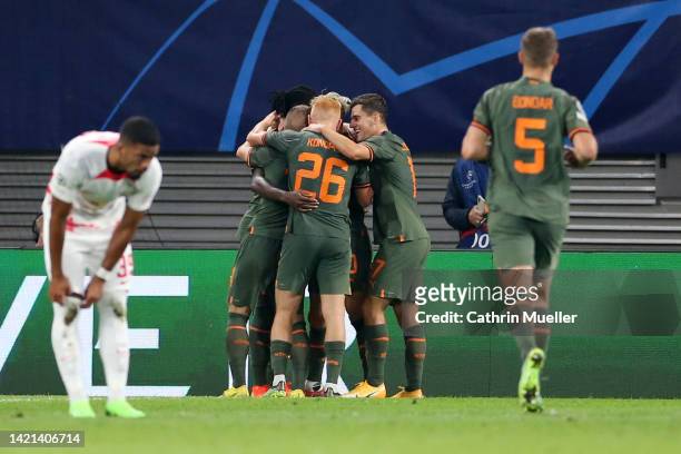 Lassina Traore of Shakhtar Donetsk celebrates with teammates after scoring their team's fourth goal during the UEFA Champions League group F match...