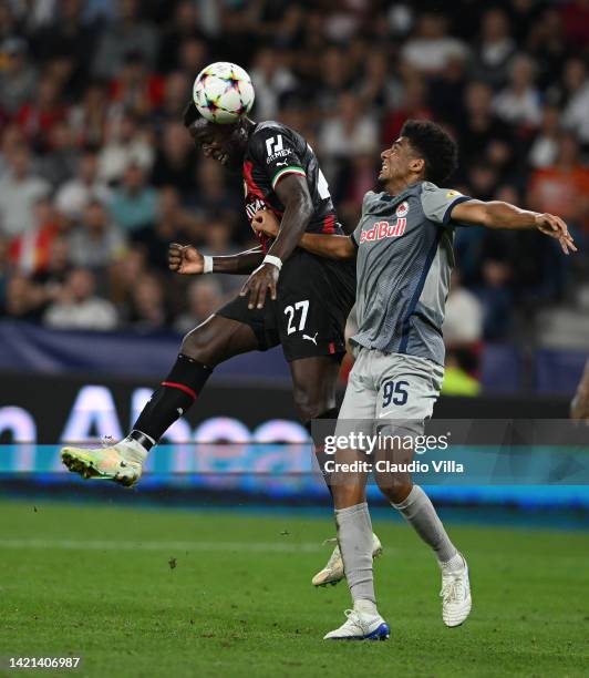 Divock Orig of AC Milan competes for the ball with Bernardo of FC Salzburg during the UEFA Champions League group E match between FC Salzburg and AC...