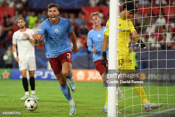 Ruben Dias of Manchester City celebrates after scoring their side's fourth goal during the UEFA Champions League group G match between Sevilla FC and...