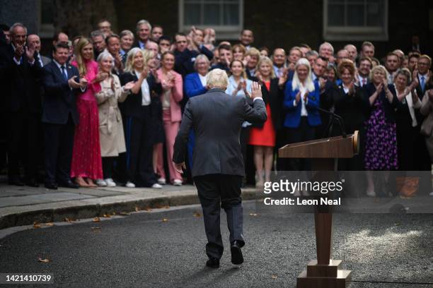 Boris Johnson waves to supporters after addressing the media from outside number 10 before formally resigning as Prime Minister, at Downing Street on...