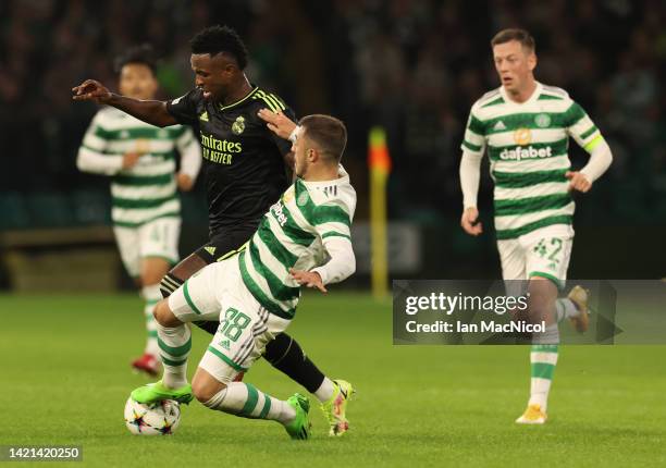 Vinicius Junior of Real Madrid vies with Josip Juranovic of Celtic during the UEFA Champions League group F match between Celtic FC and Real Madrid...