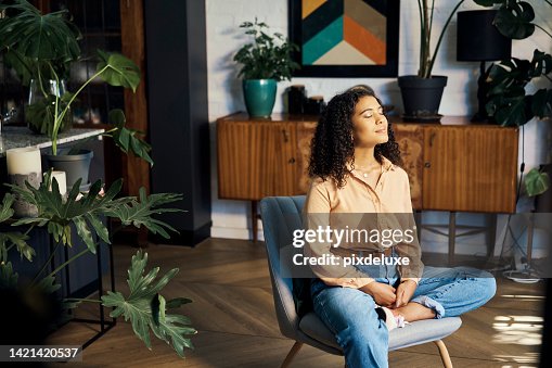 Peace, relax and happy mindset of a woman from Indonesia taking a mind and meditation home break. Happiness of woman on a house living room lounge chair thinking about life, gratitude and self care Peace, relax and happy mindset of a woman from Indonesia taking a mind and meditation home break. Happiness of woman on a house living room lounge chair thinking about life, gratitude and self care