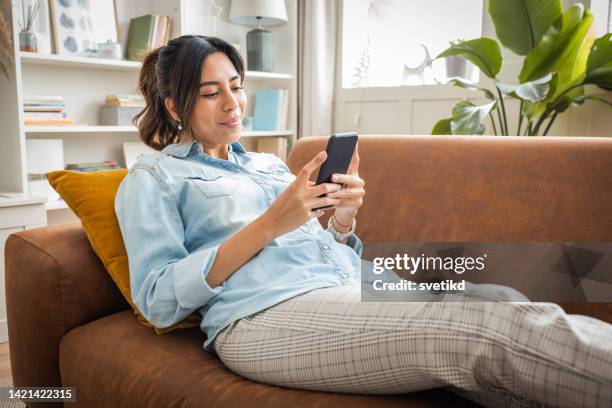 relaxing day at home - sofa stock pictures, royalty-free photos & images