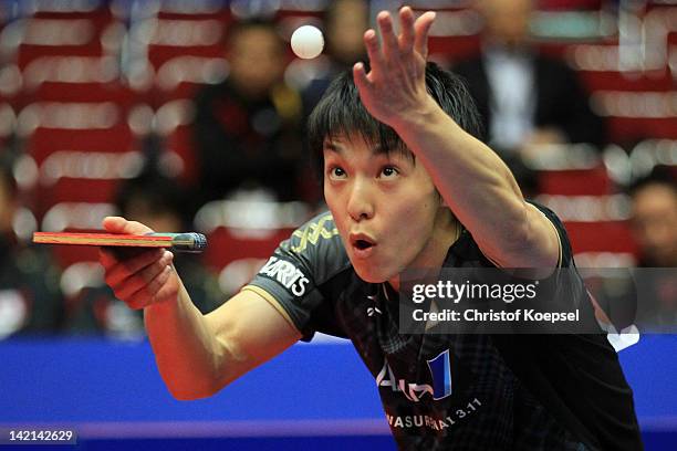 Kenji Matsudaira of Japan serves during his match against Yang Zi of Singapore during the LIEBHERR table tennis team world cup 2012 championship...